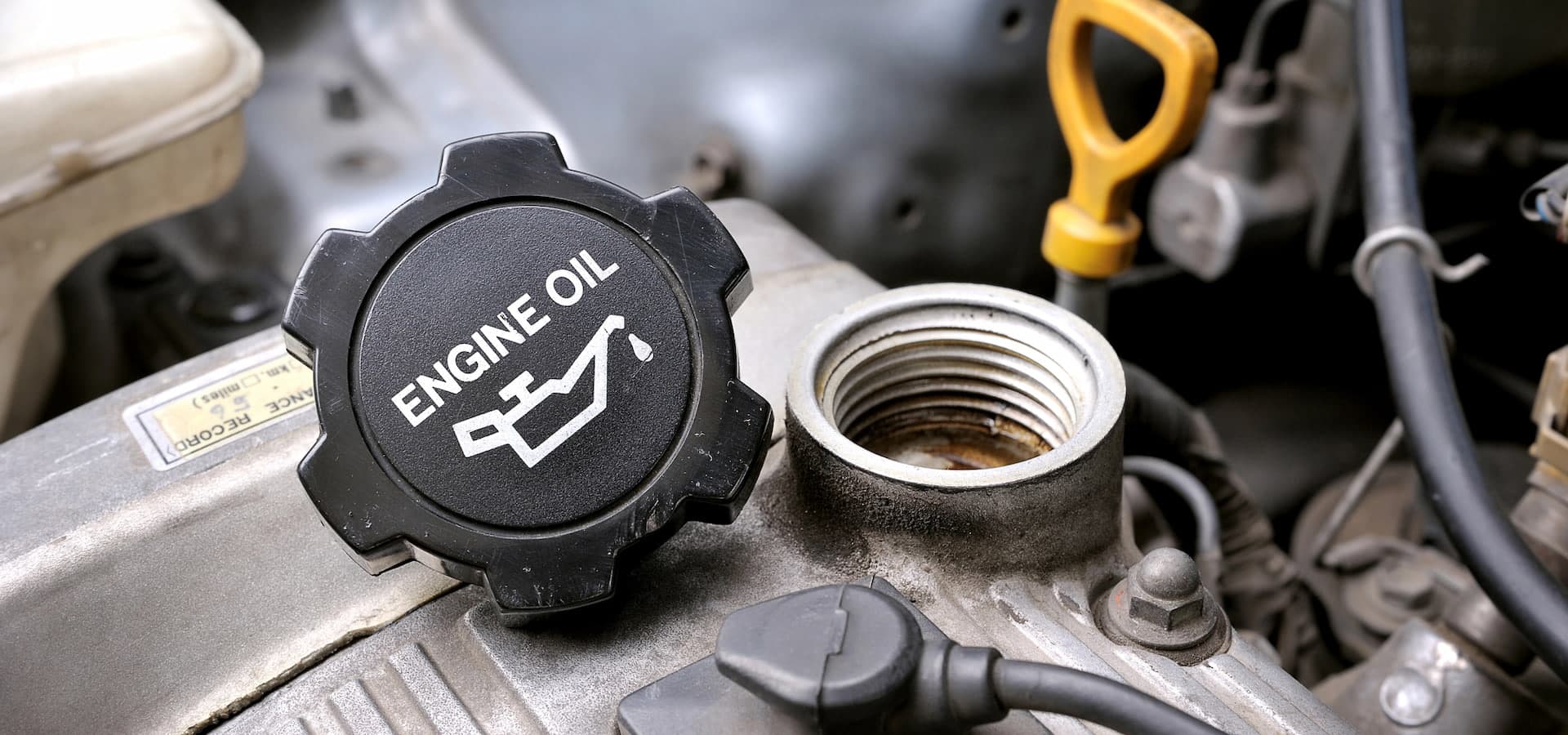 Open engine oil cap and filler neck