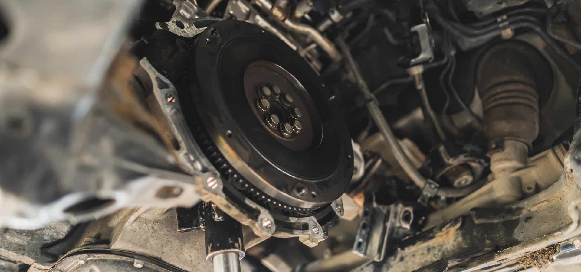 Close-up of car flywheel and transmission assembly