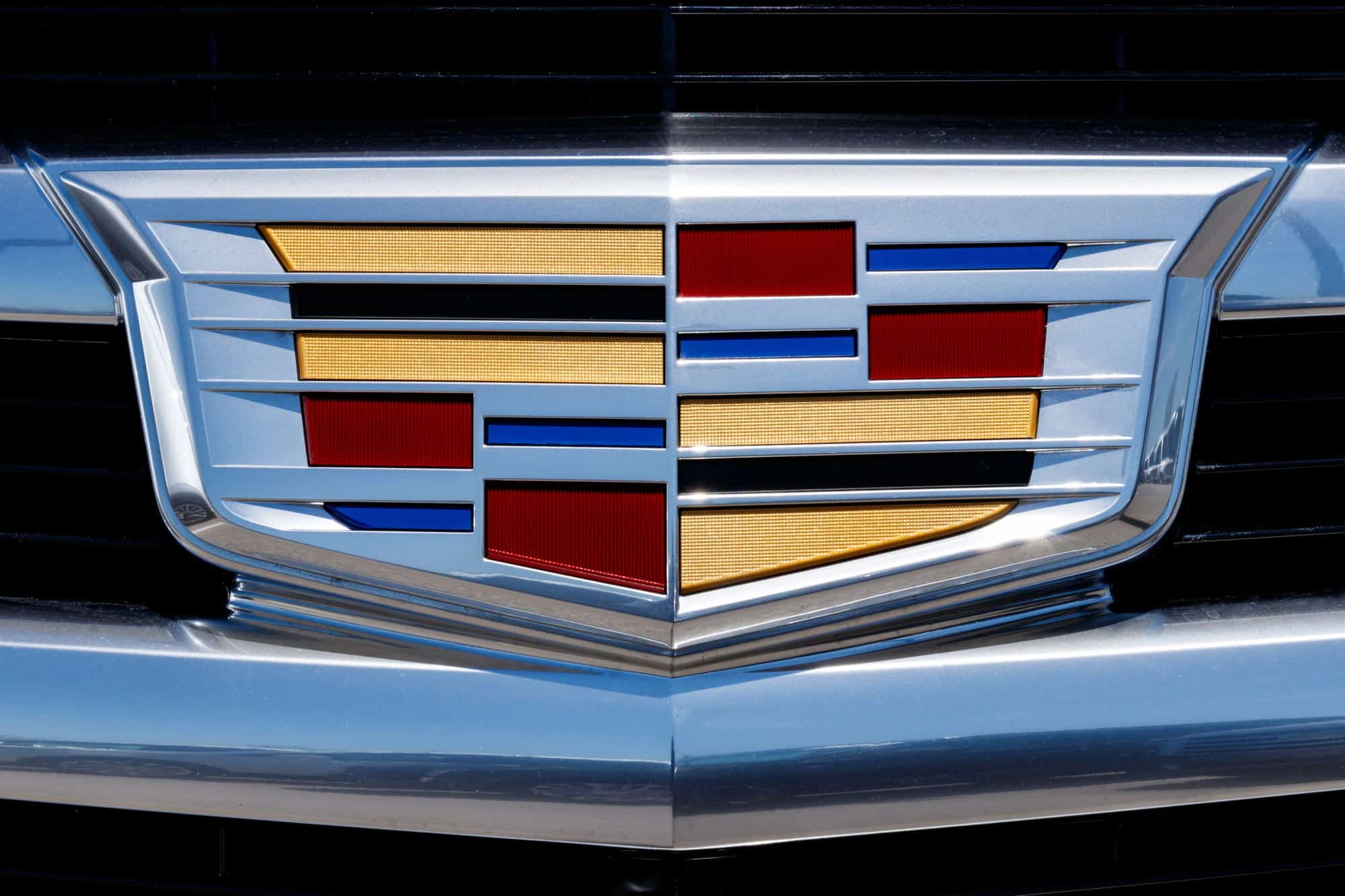 Close-up of Cadillac emblem on car grille