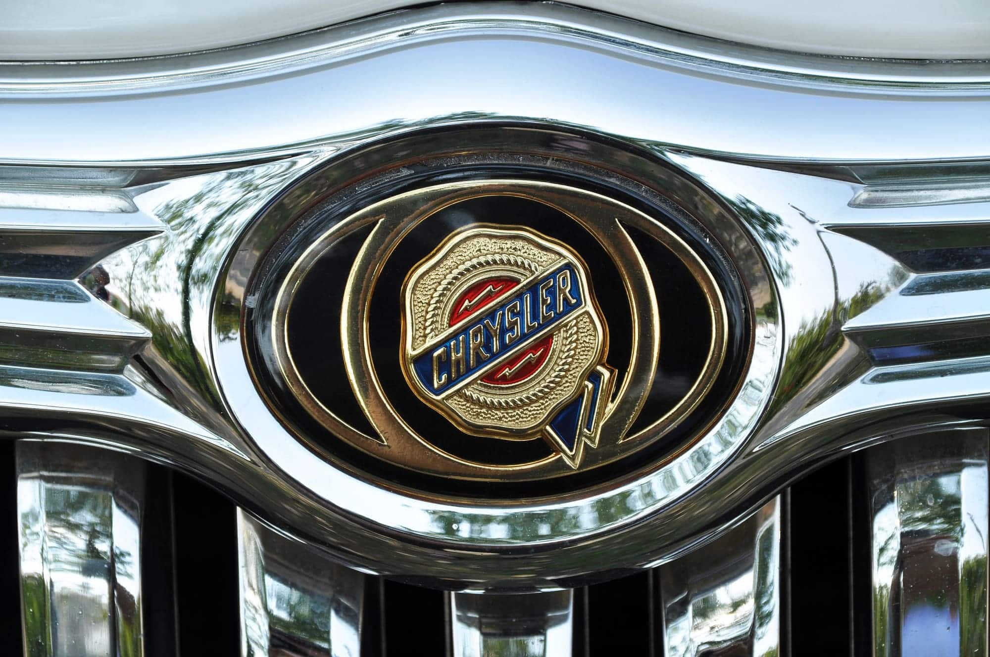 Close-up of Chrysler emblem on chrome grille