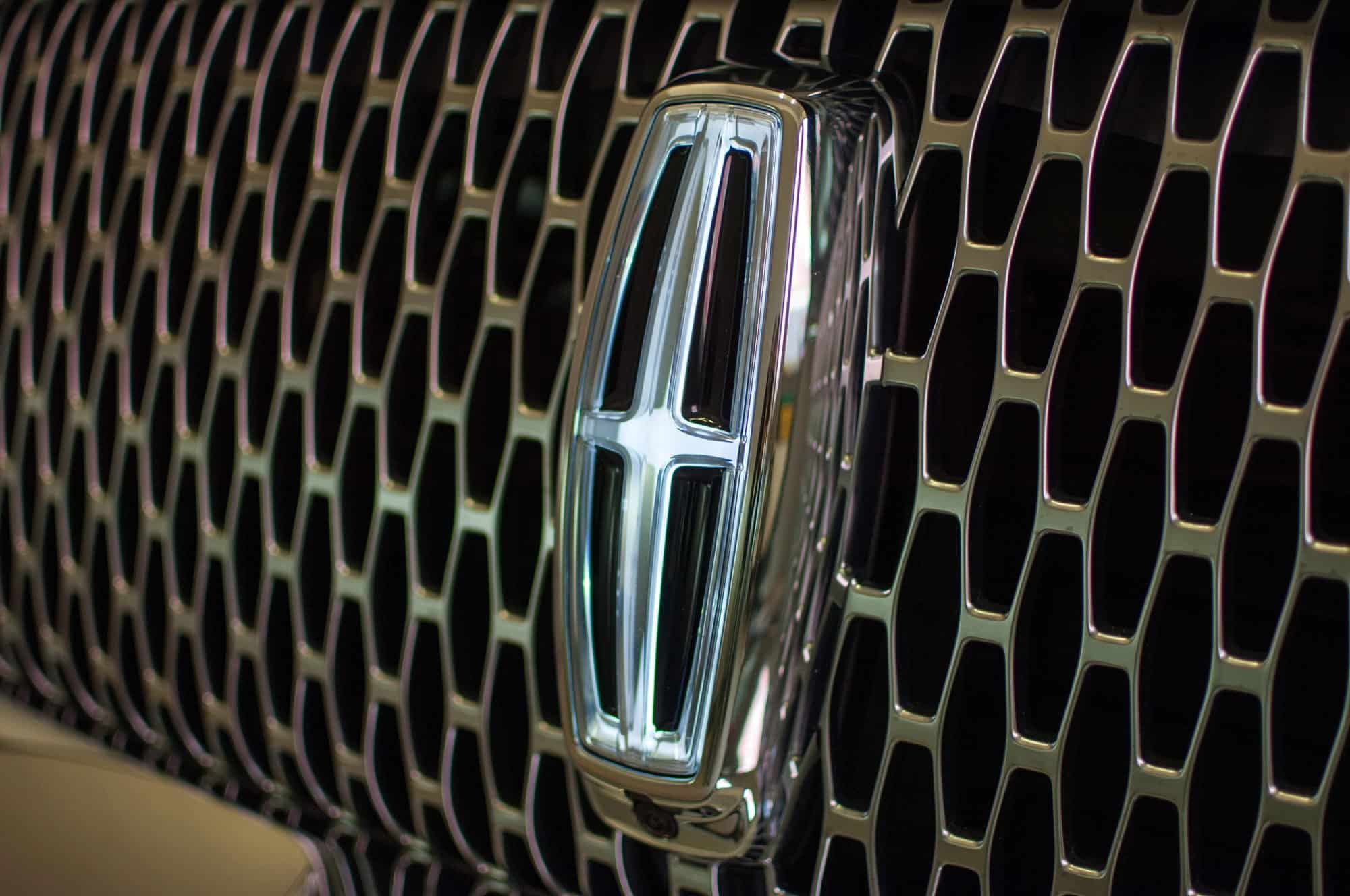 Close-up of Lincoln emblem on chrome grille